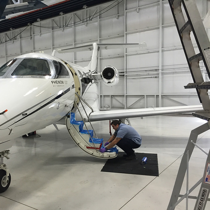 Phenom SN179 in hangar at BDL